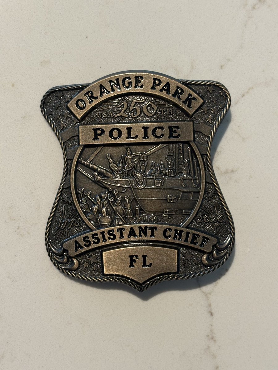 You will see several of our officers wearing this badge throughout 2026.  This is a commemorative badge for The United States Semiquincentennial, the celebration of America's 250th anniversary, July 4, 2026,  commemorating the signing of the Declaration of Independence in 1776.