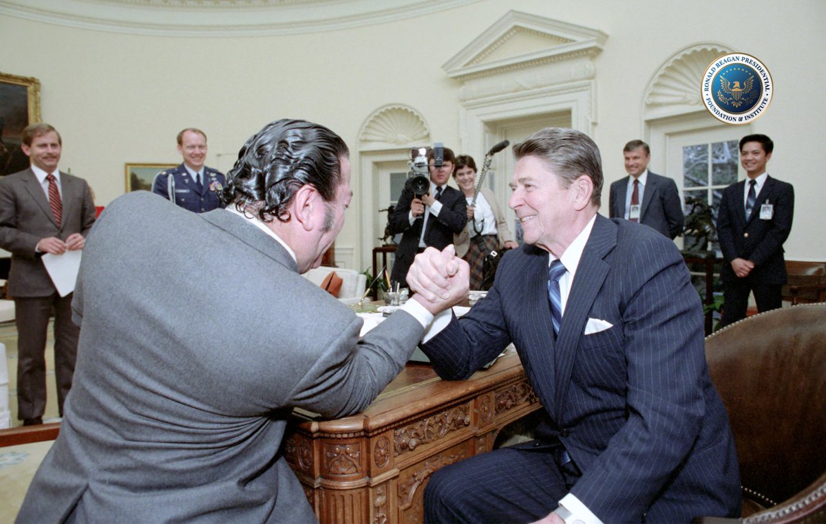 RonaldReagan's tweet photo. With the Winter Olympics kicking off tomorrow, consider this a little warm-up. 💪

President Reagan arm-wrestling in the Oval Office with Dan Lurie of Muscle Training Magazine. https://t.co/DMqfOmQ4gj