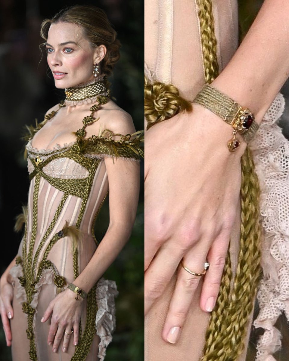 addictionmargot's tweet image. margot robbie is wearing the bracelet that belonged to charlotte brontë.

the strap around the jewelry is made of the intertwined hair of her dead sisters, emily and anne brontë.