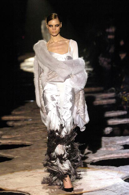 Gucci by Tom Ford, 
Fall/Winter 2004. 
Sequin, Silk, Fur &amp; Tassel Accented dress + coat.