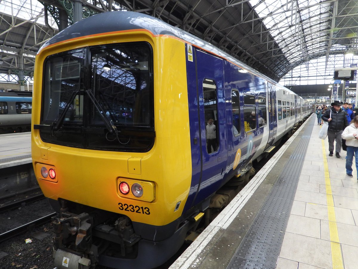 DanSpotter86's tweet image. Heres a shot of @northernassist Class 323213 AC EMU seen here in Manchester Piccadilly Station with part of an @TPExpressTrains in shot on 07/10/25. #Class323 #ManchesterPiccadilly #MCR #Manchester #WCML