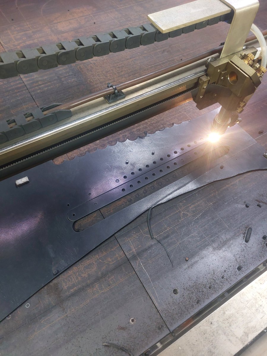 Laser cutting straps for the puppy/bone gags. #leatherwork #CO2laser