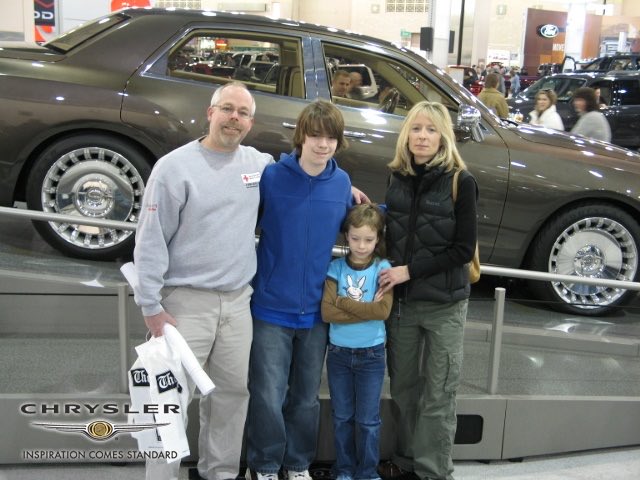 PerryJudge's tweet photo. In honor of the current car show going on, here’s a family pic from like 19 years ago. You can tell i hated nothing more than being dragged to the car shows lmao https://t.co/jjEdFWPEqO