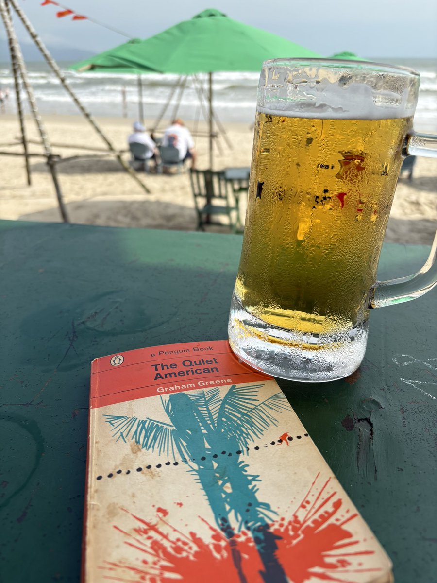 StevenBrydonAU's tweet photo. In Da Nang…posting a gratuitous “beer, beach and look at the intelligent book I’m reading” shot. #yesidhatemetoo https://t.co/XjrXd5Rrmo