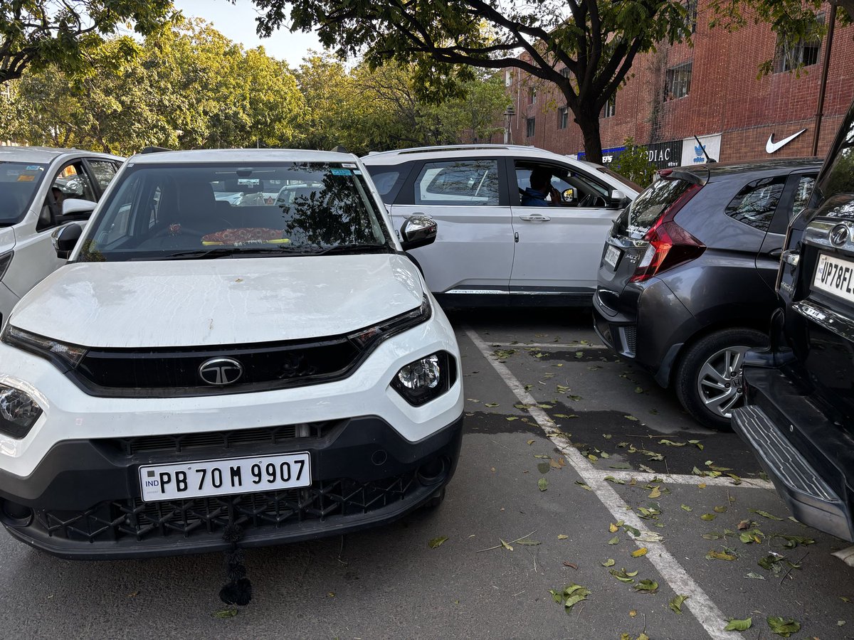 rajrad's tweet photo. At 3:25 pm at Sector 17 Chandigarh parking. The owner of this car has blocked the car and also put the hand brake. Absolute nonsense and insensitive! @trafficchd @PunjabTraffic pl take note. Immediate challans should be  issued. We were to go to hospital and got stuck https://t.co/fewmcBWg3y