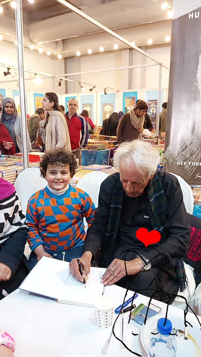 TheLIBF's tweet photo. Mustansar Hussain Tarar sb signing books for the readers on the second day of #LahoreInternationalBookFair at @sangemeel stall
#LIBF26 #books #Lahore https://t.co/7lg1LCd823
