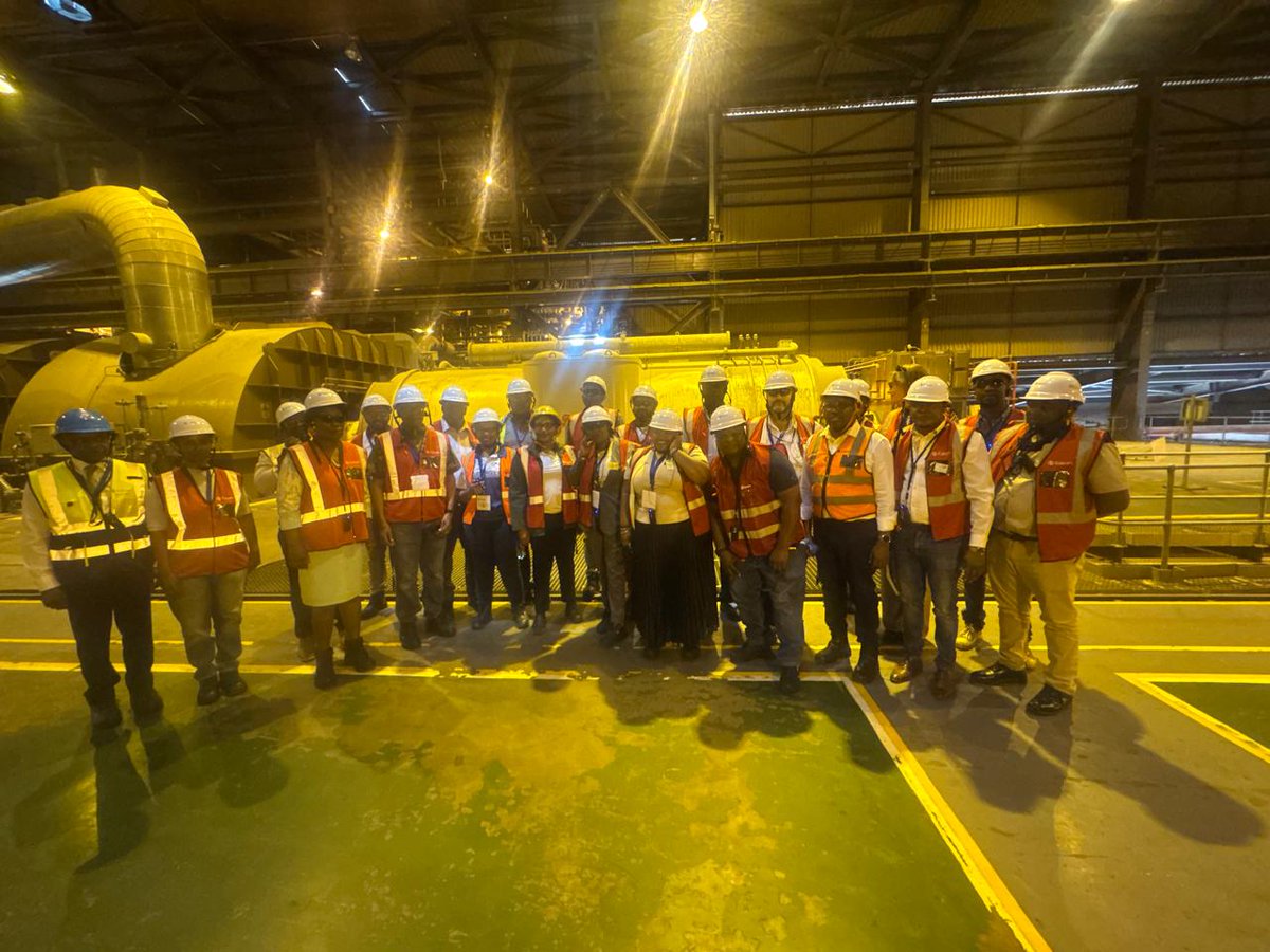 Interior view of Eskom Kusile Power Station with staff in PPE, South Africa – representing the embattled national electricity infrastructure.