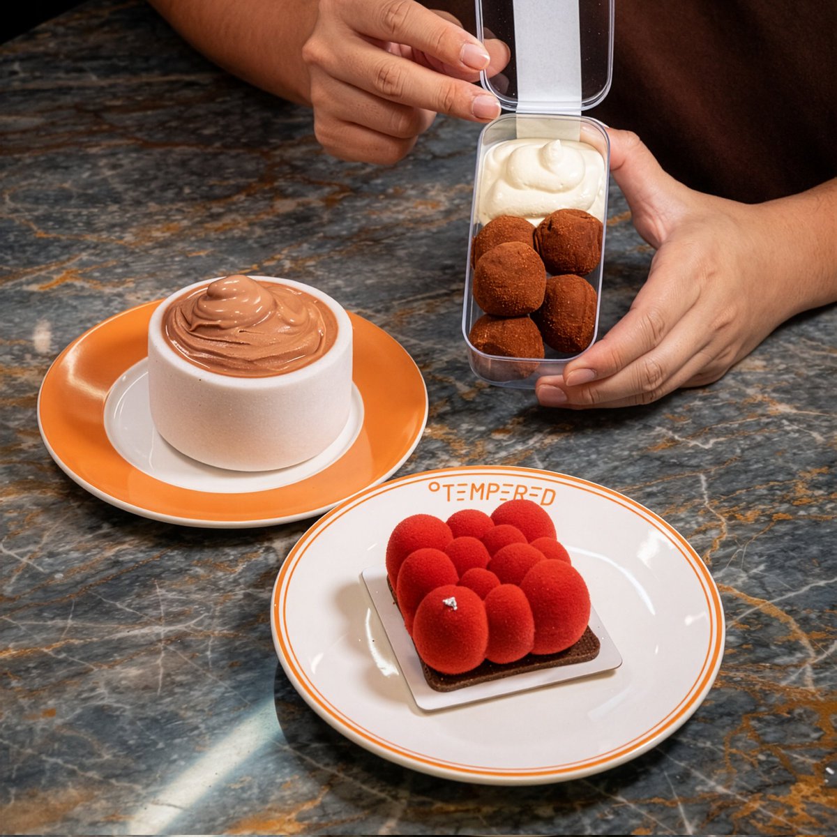 CafeStoryTH's tweet photo. 📍 Tempered 🍫👨🏻‍🍳🍦 One Bangkok

Where chocolate can be anything and everything. 
ที่ Tempered เชื่อว่า ช็อกโกแลตไม่ใช่แค่ของหวาน แต่คือรสชาติที่เล่าเรื่องได้ทั้งเครื่องดื่ม ขนม และอาหารคาว ✨

คาเฟ่มินิมอลสุดเท่ใจกลาง One Bangkok มีทั้งโซน Indoor & Outdoor และความเซอร์ไพรส์จากโกโก้ในทุกมิติ 🤎

เมนูซีเคร็ตเลยที่อยากบังคับทุกคนมาชิม ขอยกให้ขบวนเจลาโต้โฮมเมด ที่ใช้คำว่าอร่อยได้เปลืองมาก ชิมแล้วชิมอีก จนอยากเหมาทุกรส!

เข้าเดือนกุมภาทั้งที ก็ต้องดื่มด่ำความรักผ่านเมนู Valentine ของที่นี่เลย ทุกจานได้ช็อกโกแลตมาชูรสชาติให้มีมิติยิ่งขึ้น ไม่ว่าจะเป็น 

​💖Beetroot Quinoa Salad
ปลุกความสดชื่นด้วย ควินัวสลัดบีทรูทดองและซัลซามะม่วงน้ำดอกไม้ จานอาหารที่ชูรสสัมผัสเปรี้ยวหวานเผ็ดอย่างลงตัว ยกระดับความอร่อยให้ล้ำลึกยิ่งขึ้นด้วย บัลซามิกดาร์กช็อกโกแลต ที่เติมมิติความหวานมันได้อย่างโดดเด่นและไม่ซ้ำใคร 

​💘Risotto Dark Chocolate
เปิดประสบการณ์เหนือความคาดหมายกับ “รีซอตโต้ดาร์กช็อกโกแลต” เมนูสร้างสรรค์ที่นิยามความแปลกใหม่อย่างมีระดับ รสสัมผัสนุ่มลึกและกลิ่นหอมกรุ่นจากช็อกโกแลตแท้ ผสานเข้ากับความกรุบกรอบของมันม่วงทอด และความสดชื่นของบีทรูทเจล มอบมิติรสชาติที่ซับซ้อนแต่ลงตัว เพื่อให้มื้ออาหารของคุณพิเศษกว่าที่เคย

💕​Red And White (Beef & Fish)
การบรรจบกันของสองขั้วรสชาติ จากความสดของ เนื้อปลากะพง สู่ความหนักแน่นของ เนื้อวัว เสิร์ฟพร้อมพิวเรสองสไตล์ ทั้งพริกยักษ์แดงและเห็ดป่า จานนี้คือบทพิสูจน์ของเทคนิคการปรุงที่เปลี่ยนความต่าง ให้กลายเป็นความสมบูรณ์แบบที่น่าหลงใหล

หรือจะส่งต่อความรักผ่าน ​🤎Dubai Chocolate Chewy Ball ของที่นี่ที่พิเศษไม่เหมือนใคร เพราะสอดไส้ช็อกโกแลตกานาซ ที่ทำจาก Chocolate Lab ของ Tempered เอง ใช้เมล็ดโกโก้ในไทยอีกด้วย 

เมนูอื่น ๆ ก็มีนะ ถ้าเลิฟ All Day Brunch แนะนำ 💚Avocado Toast หอมเนย ท็อปด้วย Smashed Avocado ล้นๆ เชดดาร์ชีสเยิ้ม ๆ
หรือถ้ามุ่งมั่นมาทานจริงจัง ตัว Main Course อย่าง ​💛Chocolate Beef Bourguignon คือเจ้มจ้นมากก ทั้งเนื้อตุ๋นที่ใช้ Thai Cocoa-Infused เพิ่มความเข้มข้น เสิร์ฟคู่กับมันบดเนื้อเนียน เข้ากันไม่ไหว

สายฮอป สายหวาน ไม่อยากให้พลาด ❤️Scarlet ไวท์ช็อกพานาคอตต้า ที่เติมความสดชื่นด้วยครีมและคอมโพทราสพ์เบอร์รี่ พร้อมด้วยหลากหลายเลเยอร์ที่ให้รสชาติน่าค้นหา โดดเด่นด้วยสีแดงที่สดใสและเต็มไปด้วยพลัง แทนความปรารถนาดีที่อยากให้คุณประสบความสำเร็จและได้รับพลังงานดี ๆ อย่างเต็มเปี่ยม เหมือนกับสีสันของ Scarlet 

🧡​Chocolate Gelato แบบ Single Origin ที่ดึงคาแรกเตอร์โกโก้ไทยออกมาได้ถึงใจ

🤍​Dirty Chocolate ใช้ 75% Dark Chocolate เข้มๆ ราดลงบนนมสดเย็นจัด เต็มสิบให้ร้อย

ตามมาสัมผัสรสชาติที่แตกต่างของ “ช็อกโกแลต” ในแบบที่คุณจะต้องตกหลุมรักที่ Tempered กันนะทุกคน

🗺พิกัด: One Bangkok ชั้น 2 โซน Parade
🕑เปิดทุกวัน 10.00 - 21.00 น.