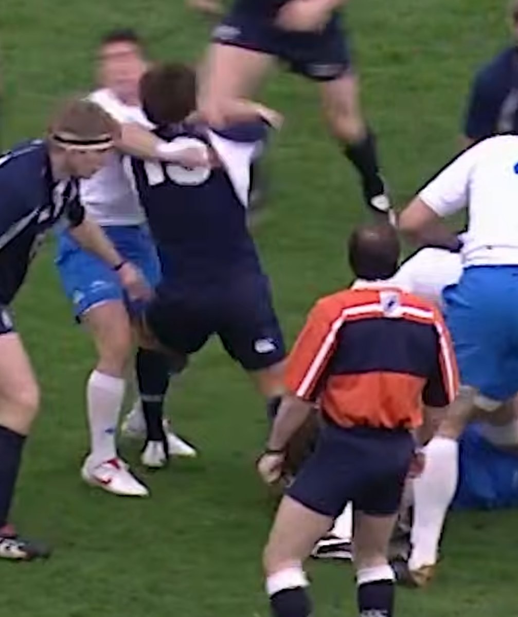 crocusnedloyd's tweet photo. Watching Scotland's match versus Italy in 2006. Here is Scottish centre, Marcus de Rollo, openly punching an Italian player at the back of a ruck in the second minute of the game. No remarks from commentators, ref, TMO,  etc. How the game has changed. #SixNations2026 https://t.co/1mrTqBW0zA