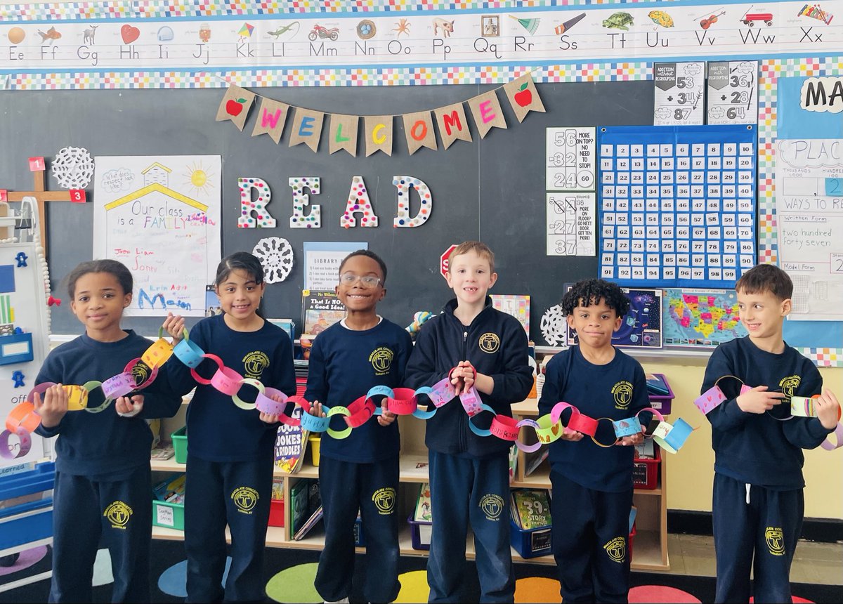 MrsBrady_ICS's tweet photo. Each paper link represents a kind act by a 2nd grade student. Together, these links form our spiritual bouquet for the installation of Archbishop-designate Ronald Hicks. This display shows how kindness connects us as a community of faith. @icschool_online https://t.co/CCyyMsn5hL