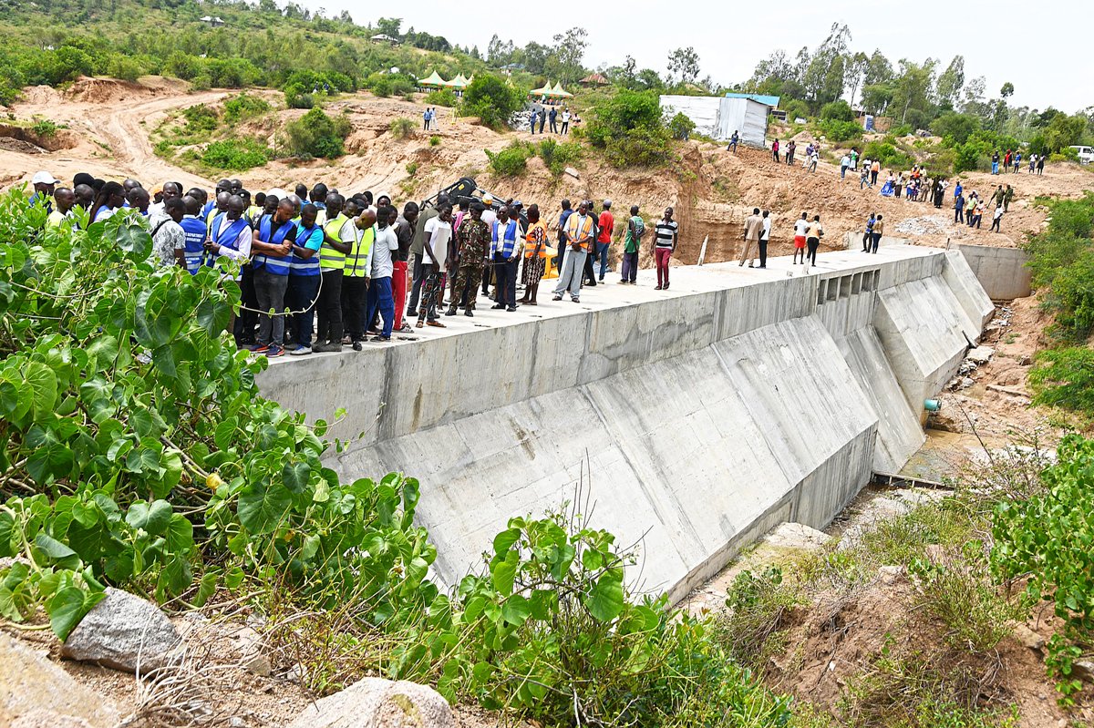 EphantusKim's tweet photo. Today I had the pleasure of inspecting the ongoing construction of the Okundi Dam Irrigation Project in Karachuonyo Constituency, Homa Bay County, alongside Hon. Adipo Okuome, the Deputy County Commissioner, and senior officials from the County Government.

The project is a major intervention aimed at transforming livelihoods and strengthening food security in the area by providing a reliable and sustainable water source for irrigation, domestic use, and livestock. With a storage capacity of approximately 150 million cubic litres, the dam will support year-round irrigation and significantly enhance agricultural productivity.

Implemented by the State Department for Irrigation, the project is designed to promote irrigated agriculture, strengthen resilience to drought and climate change, and enhance the livestock value chain through integrated crop–livestock production systems.

Once completed, the project will irrigate approximately 100 acres, benefiting about 100 households and supporting over 20,000 livestock units. The infrastructure package includes upstream and downstream dams, check dams, solar-powered pumping systems, piped irrigation networks, storage tanks, and communal water facilities.

During a sensitization session with project beneficiaries, I emphasized the need to prepare farmers for irrigation-based production, strengthen farmer organizations, and build capacity in crop husbandry, water management, and agribusiness. This will ensure beneficiaries are fully prepared to utilize the irrigation infrastructure once completed.

Beyond improved water access, the project is expected to boost maize and horticultural production, create employment opportunities, and raise household incomes, ultimately enhancing food and nutrition security, climate resilience, and sustainable livelihoods in Karachuonyo Constituency.

I appreciate the support of Hon. Adipo Okuome and the County Government, who reaffirmed their commitment to work with the National Government in strengthening farmer capacity through extension services.
