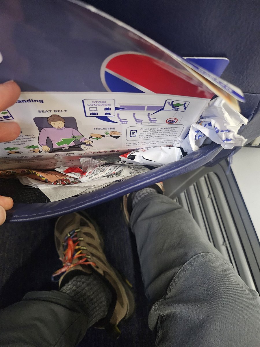 SoCalEnthu's tweet photo. @SouthwestAir seat pocket full of trash as I board flight 2125 to SAN. Assigned seat, can't move to one that's been cleaned?! https://t.co/OLiMaktIq9