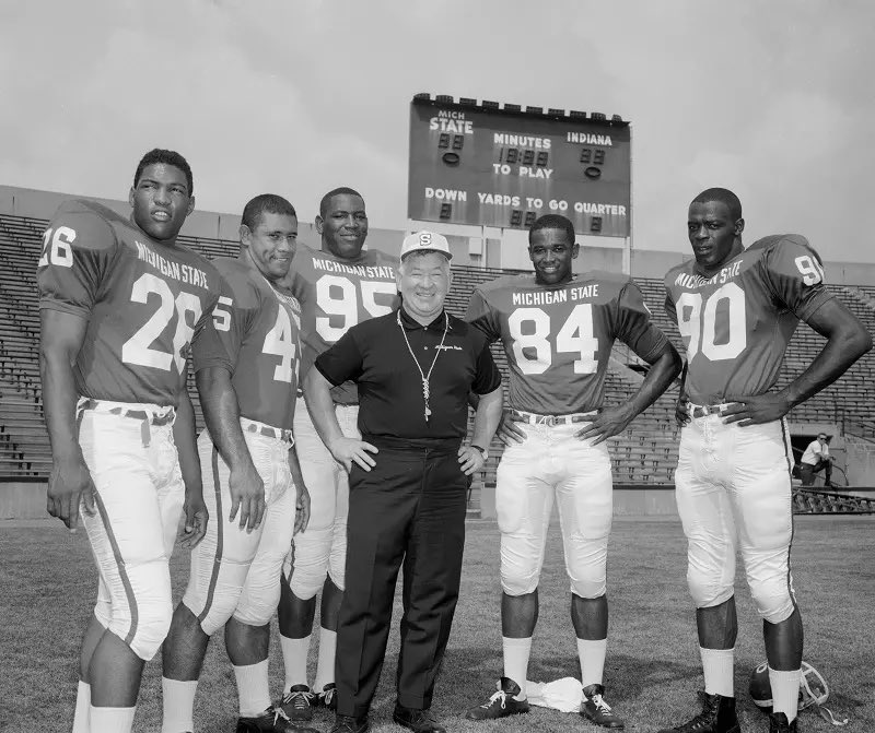 DarkoStateNews's tweet photo. There are many!

In the 1960s, Michigan State integrated the sport.

Coach Duffy Daughtery was vilified.

MSU endured endless mocking by the rest of the nation for daring to welcome Black players on the team without quotas or stipulations.

Duffy’s peers said he’d never win with so many Black players. 

How could he control them? How could he keep the racial peace?

A prominent donor vowed to withdraw his support if Duffy didn’t stop recruiting Black players.

One rival even burned a Black MSU player in effigy at a school-sanctioned rally.

The entire country was against MSU. They were certain the Spartan experiment would fail.

Duffy told them to blow it out their ass, winning back-to-back national championships in a feat no Big Ten team has achieved in 60 years since.

4 of the Black players everyone told MSU to shun went 1st, 2nd, 4th and 8th in the 1967 NFL Draft, still the most Top-8 picks from one school in history.

Those Black stars - and the coach who told everyone else to shove it - should have a statue outside Spartan Stadium.

#GoGreen