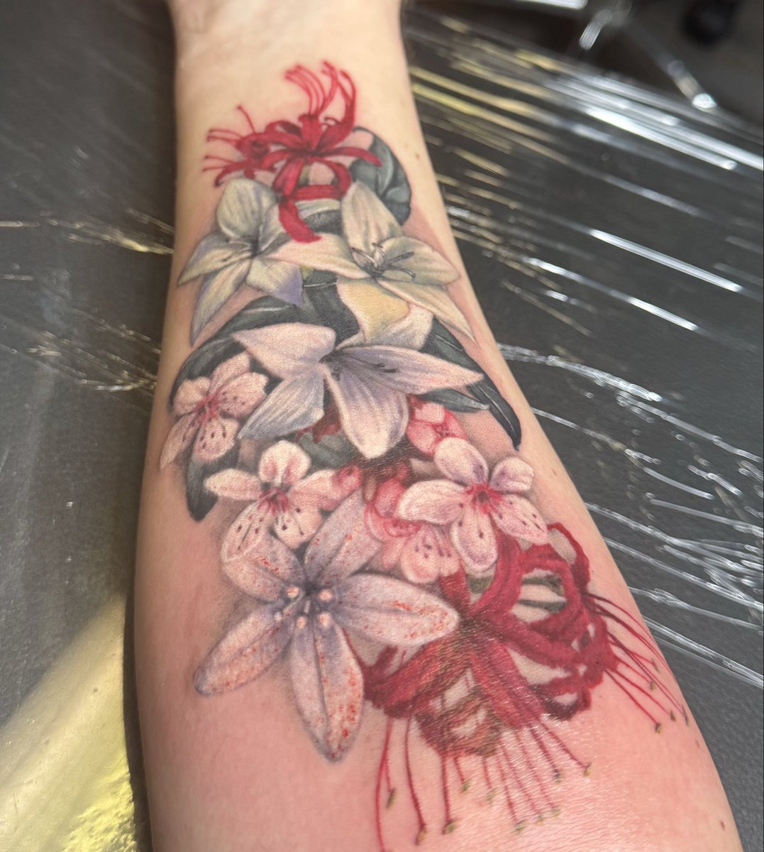 salvaged_data's tweet image. haven’t posted here in forever but figured it’d be a good time to share my new tattoo. got lunar tears (the two closer to wrist) and the drakengard 3 flower (thw two closer to elbow), i adore it and my picture doesn’t do it justice at all :3