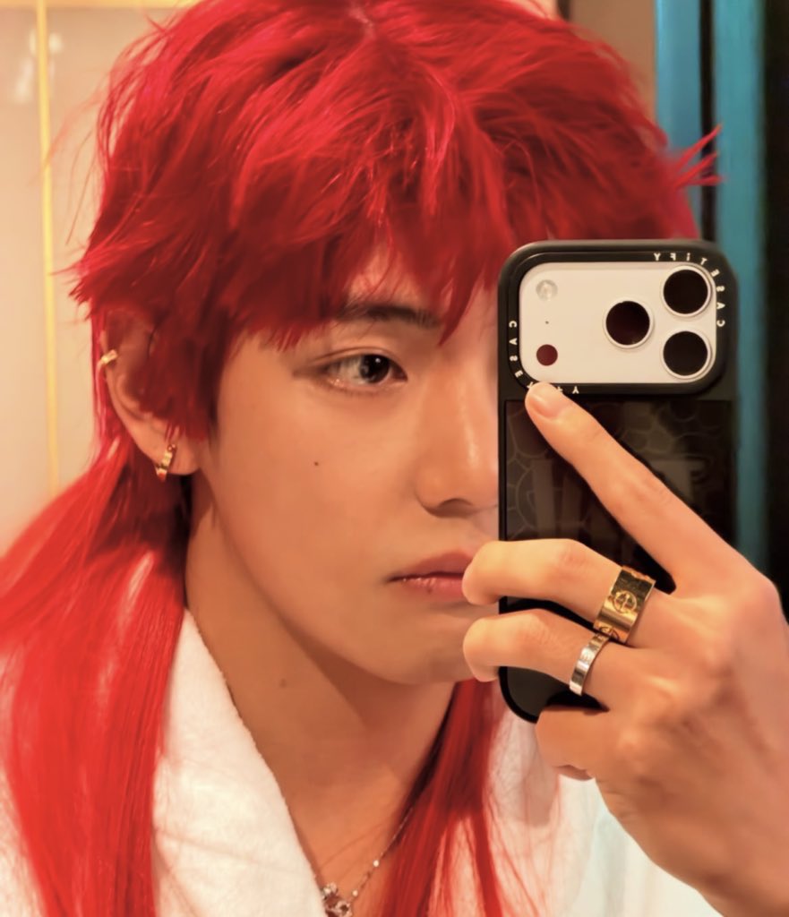 Taehyung serves in red hair, looking unfairly good and casually raising the bar yet again.