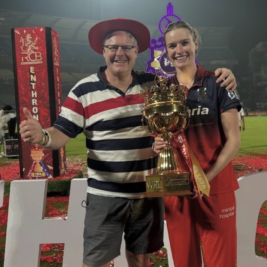 SportsByND's tweet photo. Lauren Bell and her father with the WPL trophy. 🏆❤️ #RCB #WPLFinal https://t.co/ebIDDUDa8x