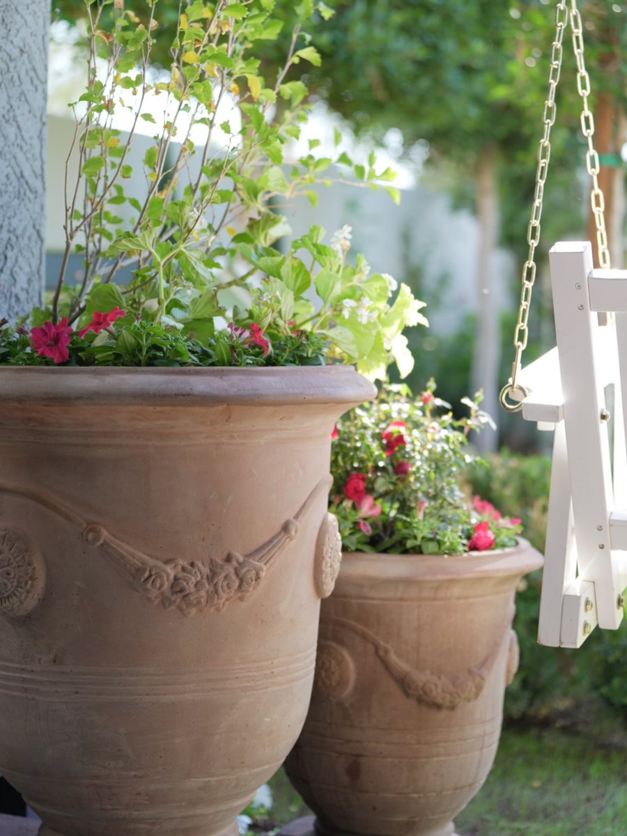 Old-world charm lures us into the garden. At @aplaceunderthe.sun’s home, fresh blooms contrast the patina of our Anduze Planters. See more styles at the link: bit.ly/3MKFAMv.