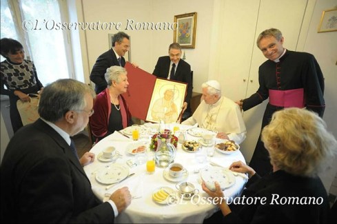 I found a photo of Pope Benedict XVI receiving a gift of a painting of Pope St. John Paul II #popebenedictxvi #popejohnpaulii
