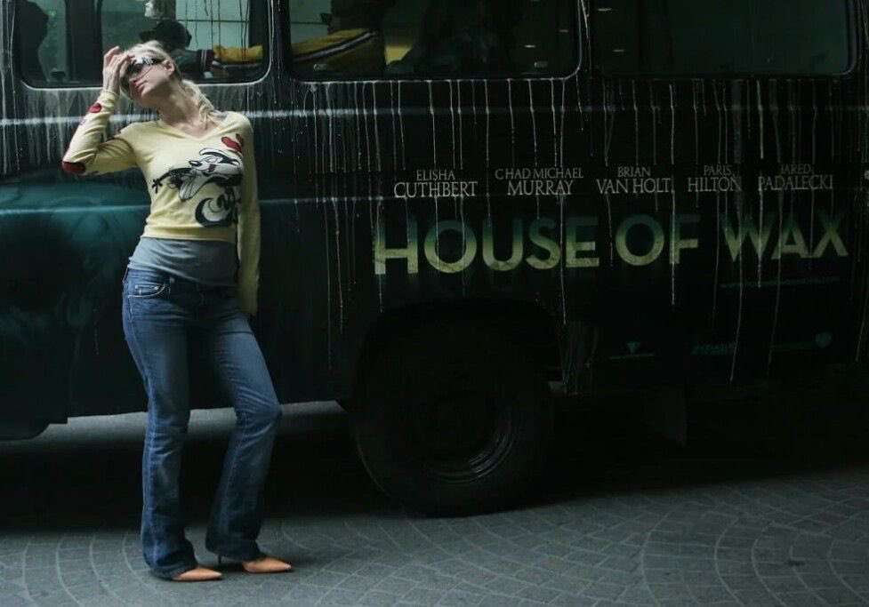 Paris Hilton poses in front of the 'House of Wax' bus, 2005