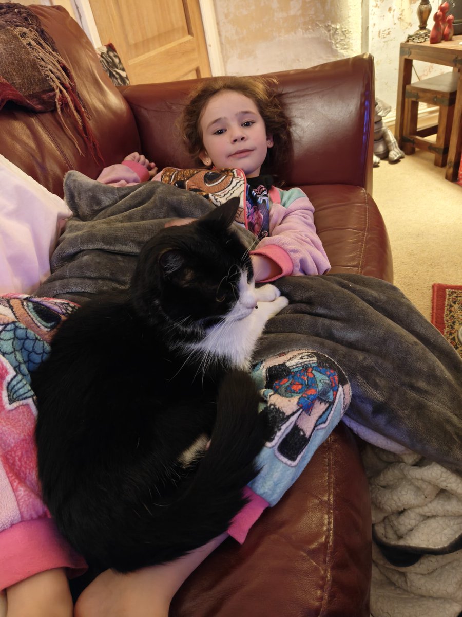 Poorly Lizzy getting cuddles from Leo ❤️