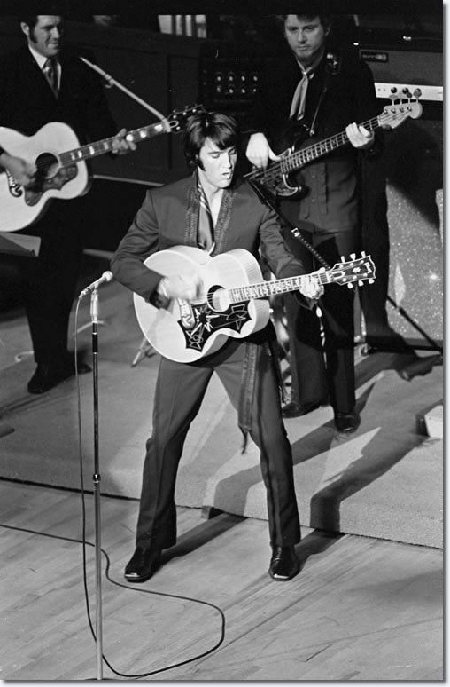 Elvis Presley on stage in Las Vegas, July 31, 1969. Photo by Terry O'Neill. This was his opening night at the International Hotel in Las Vegas. It was his first live show in eight years