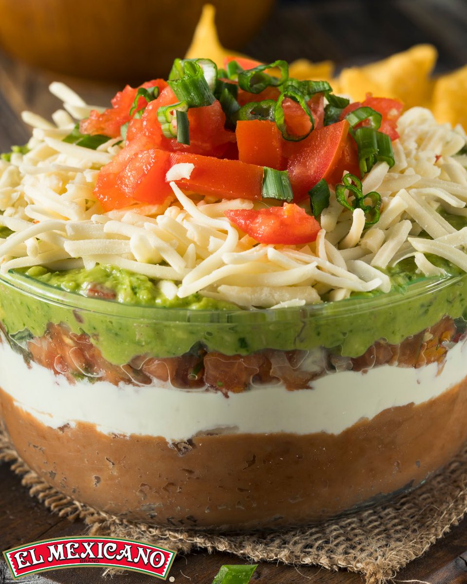 This dip is the real MVP 🏈 Layers of El Mexicano® Refried Beans, Crema Mexicana and shredded Queso Oaxaca make it a must for your Game Day spread! #AuthenticSabor