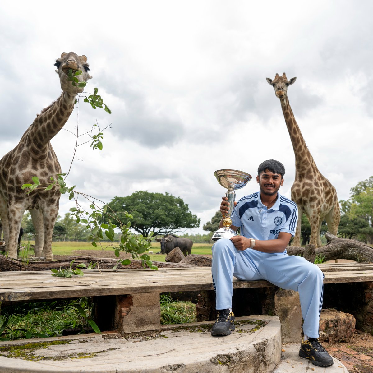Ayush Mhatre makes some new friends with the #U19WorldCup trophy 🦒🐘 

More 📲 icc-cricket.com/tournaments/u1…