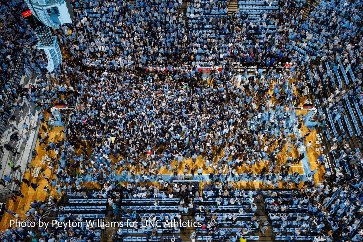 peyton_williams's tweet photo. North Carolina Tar Heel fans storm the court after a win over the Duke Blue Devils. Photo by me for @GoHeels. Taken with a remote camera mounted in catwalk. #uncvsduke https://t.co/tKWoroy3bg
