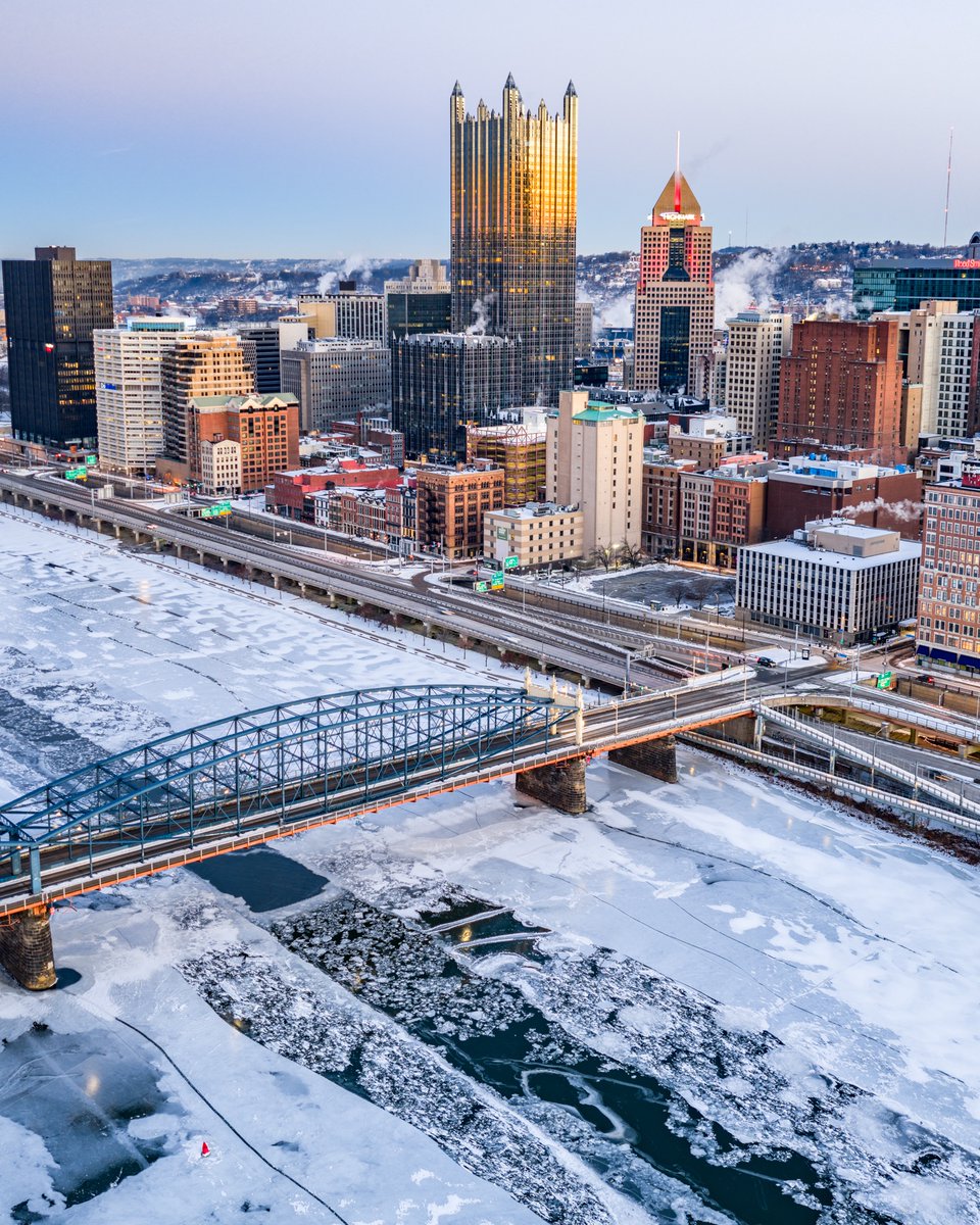 Another absolutely frigid morning here in Pittsburgh. In this photo PPG Place reflects the golden horizon just before sunrise as ice continues to form on the Monongahela River 🥶#pittsburgh