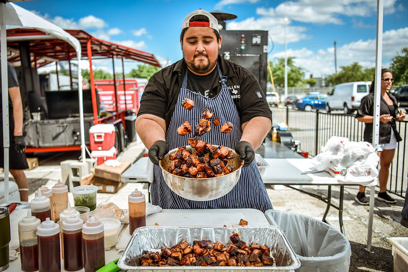 This may be the first year Eastbound Barbecue is participating in #HOUBBQ, but it doesn't mean they haven't attended before! Here's Eastbound partner Luis Lopez at the 2017 HOUBBQ Fest w/ Killen's Barbecue in an iconic photo by Robert Lerma.