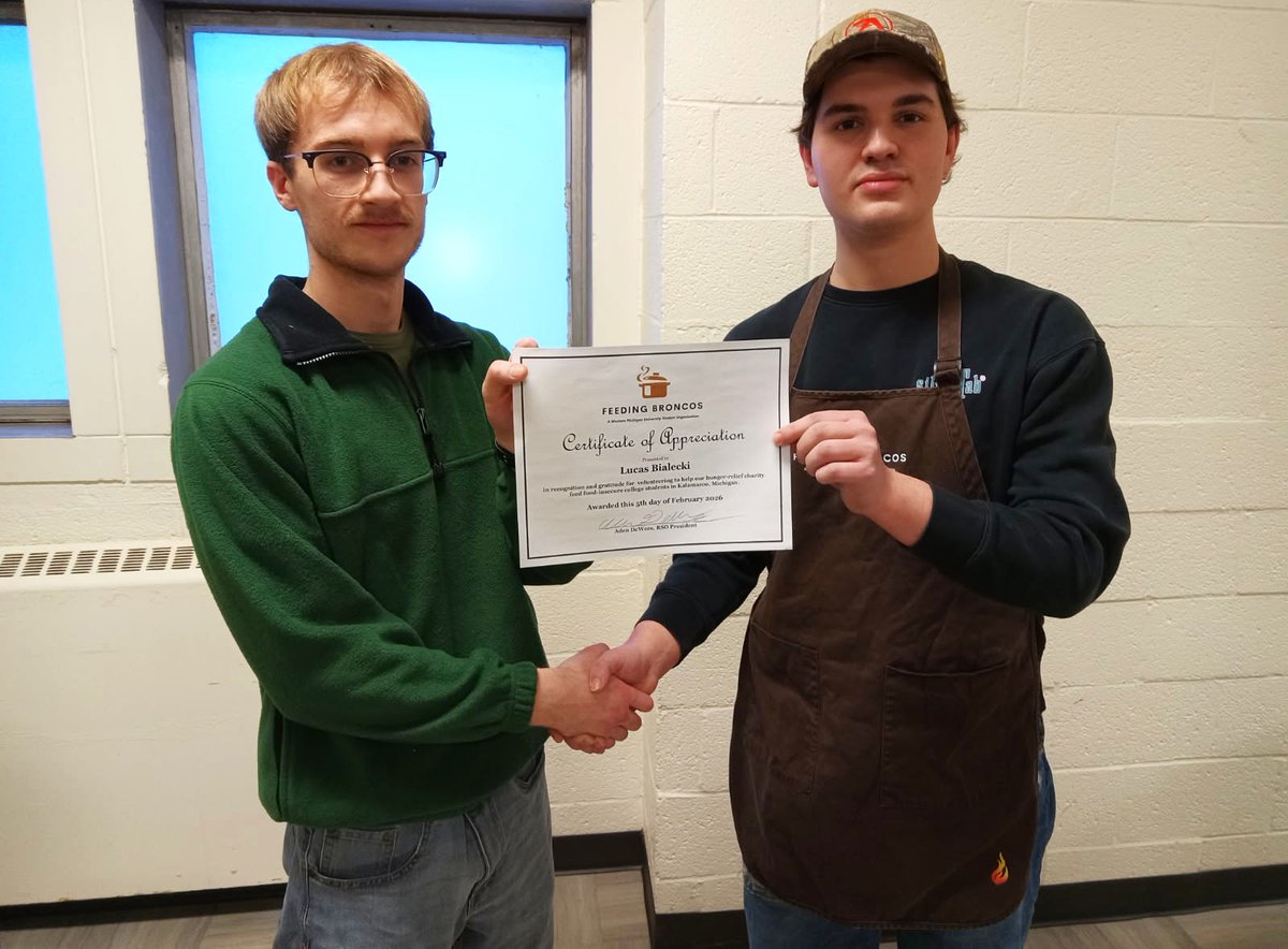 <a href="/FeedingBroncos/">FeedingBroncos</a> President, Aden DeWees, presents Certificates of Appreciation to <a href="/WesternMichU/">Western Michigan University</a> student volunteers Frank Crosson, left, and Lucas Bialecki. Congratulations.