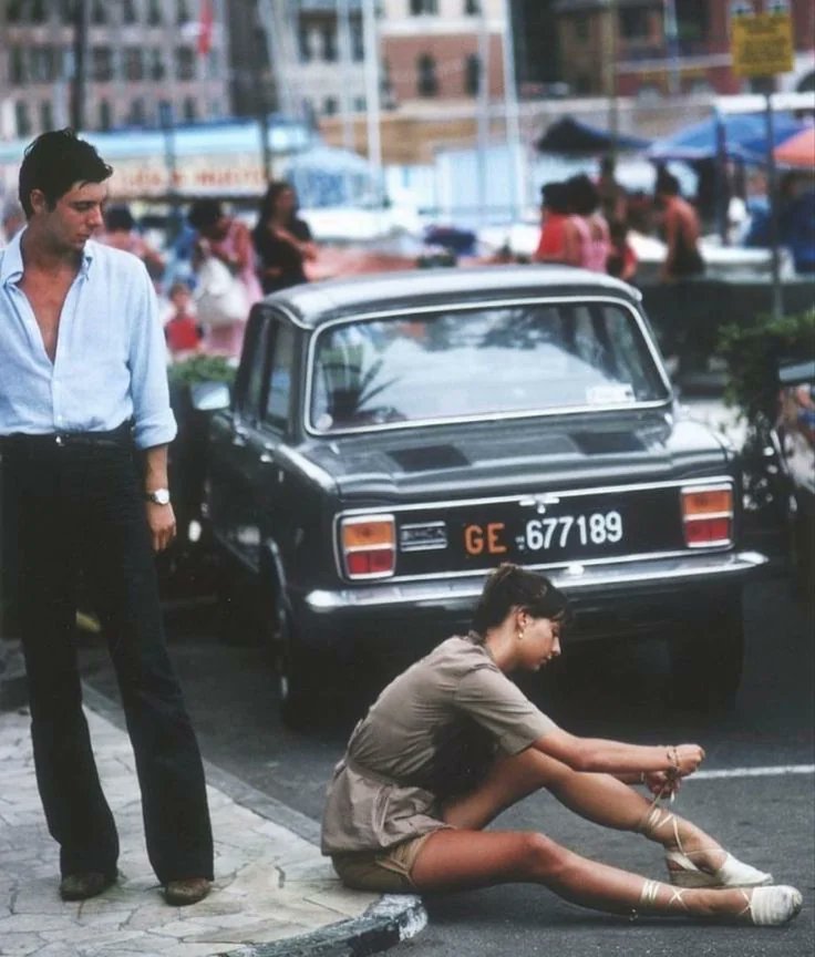 A girl ties her shoes in Portofino, Italy (1977)