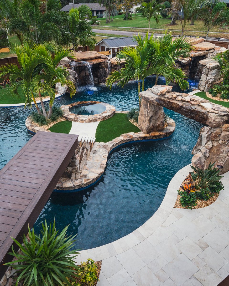 lucaslagoons's tweet image. Signature Series Insane Pool featuring a massive natural rock grotto with a dramatic rain curtain, a bridge leading to an island spa, and lush tropical landscaping that feels like a five-star resort. #insanepools #lucaslagoons #backyard