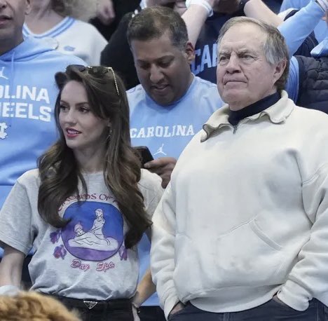 NFL_DovKleiman's tweet photo. Holy Sh*t: Bill Belichick's girlfriend Jordon Hudson wore a massage parlor tshirt throwing shade at Patriots owner Rober Kraft...

The Orchids of Asia Day Spa was the massage parlor tied to Robert Kraft's pr**titution bust in 2019.

😱😱😱 https://t.co/bsc2k6T60p