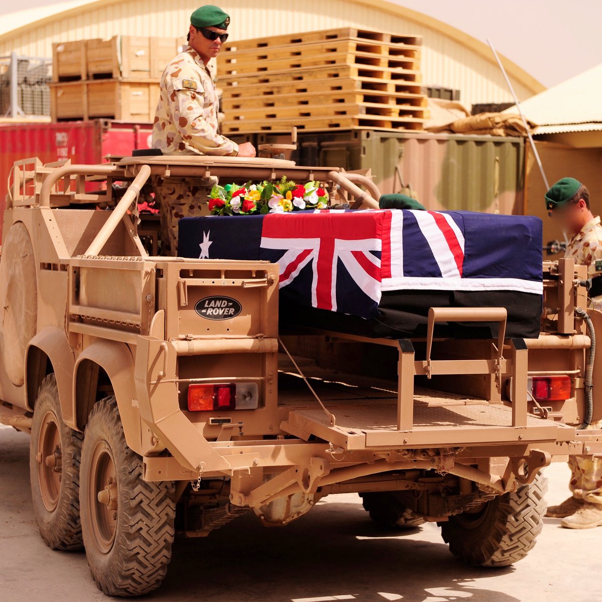 Dean Parkinson’s last photo with Tim Aplin, standing over the coffin during the ramp ceremony for the fallen soldier. Discover the life story of the fallen commando in our latest podcast. linktr.ee/LOTL