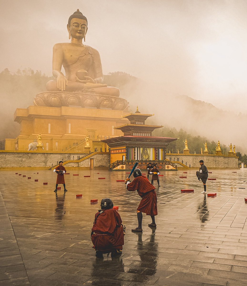 Boys playing baseball in Bhutan, Himalayas.