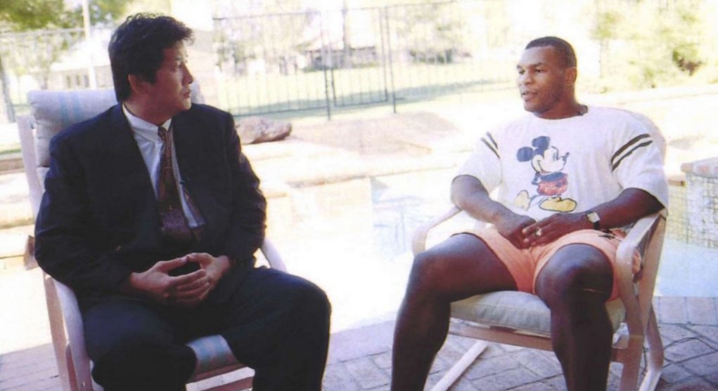 The baddest man on the planet pictured with boxer Mike Tyson.