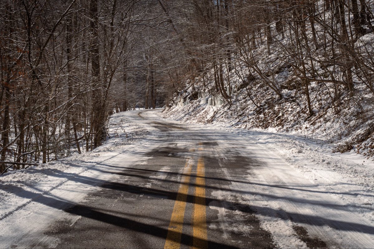 AmericanExpat6's tweet photo. A snow-covered road winds through Kanawha State Forest on Feb. 6, 2026, following winter weather that moved through the region earlier in the week. https://t.co/qNUDdc0lBD