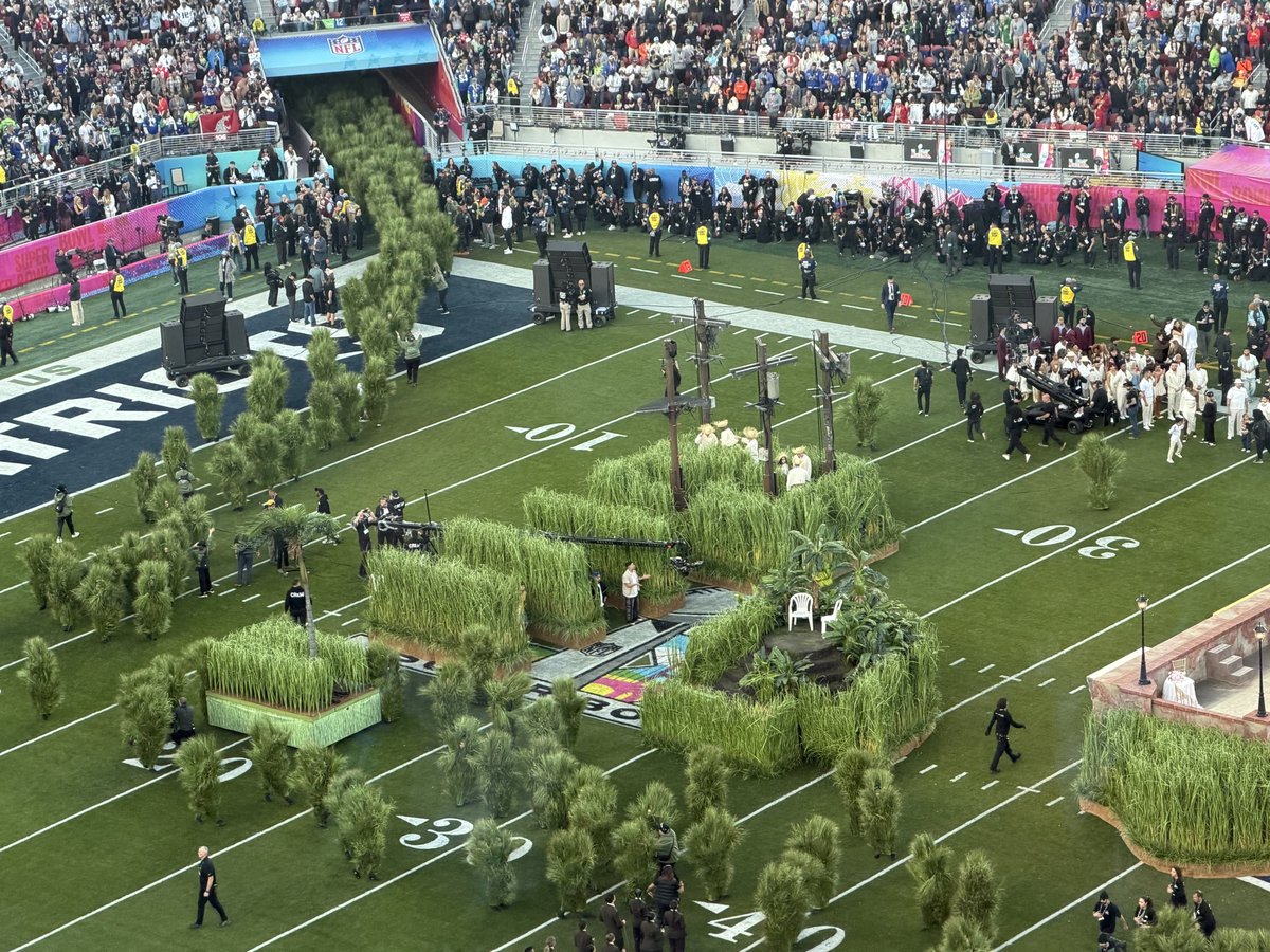 nwagoner's tweet photo. I’m not sure what’s about to happen but the setup for the halftime show looks like a nod to nearby Stanford with all these trees…

#SuperBowlLX https://t.co/x7zYH6UBd1