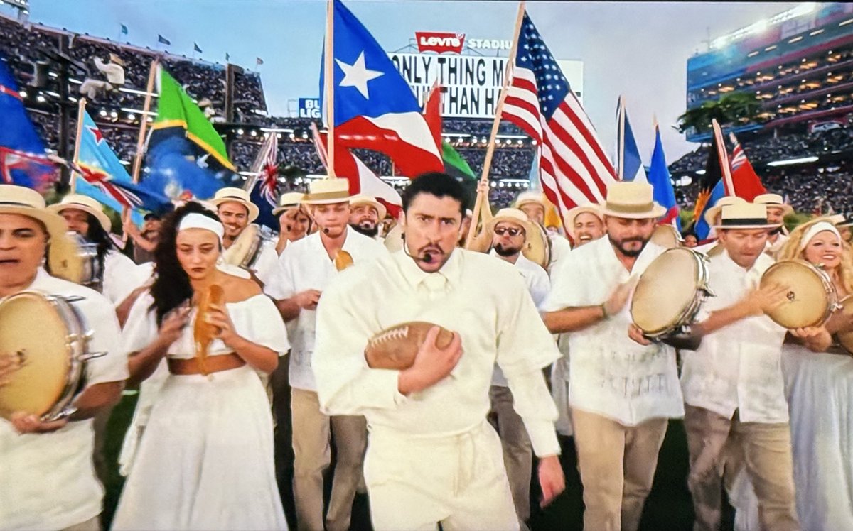 JonnyRoot_'s tweet image. The NFL having a Super Bowl Halftime Show where their performer sings ENTIRELY in Spanish &amp;amp; waves other nation’s flags, is 💯% a political statement. 

Bad Bunny will go down as the worst halftime show in the history of the league.

America deserved better for its 250th birthday.