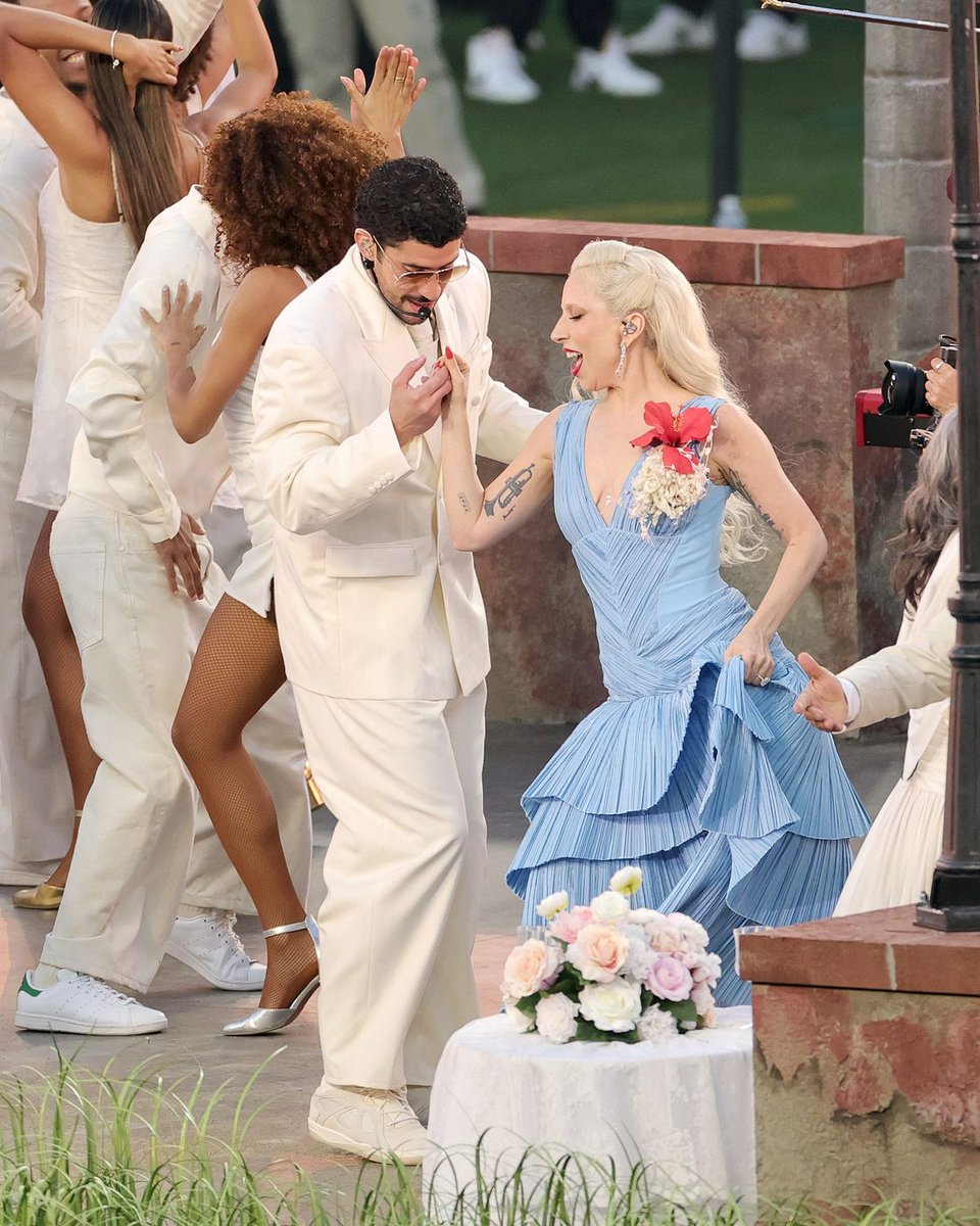 enews's tweet photo. Bad Bunny 𝒹𝒾𝒹 𝓉𝒽𝒶𝓉! Joined by Lady Gaga, Ricky Martin, and more, the Grammy-winning superstar turned the Super Bowl into a party. 🎶 (📷: Getty, Shutterstock) https://t.co/XBZ1W1WOKZ