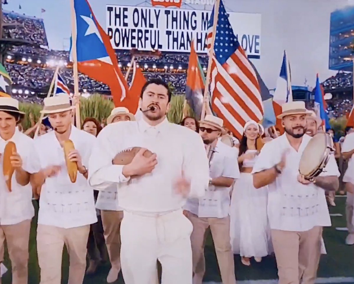 consequence's tweet photo. Bad Bunny closed his Super Bowl halftime performance by declaring "God bless America" and then running through a roll call of American countries by name:

"Chile, Argentina, Uruguay, Paraguay, Bolivia, Perú, Ecuador, Brasil, Colombia, Venezuela, Guyana, Panama, Costa Rica, Nicaragua,, El Salvador, Guatemala, Mexico, Cuba, República Dominicana, Honduras, Nicaragua, El Salvador, Cuba, Haiti, Dominican Republic, the Antilles, United States, Canada, y Puerto Rico."