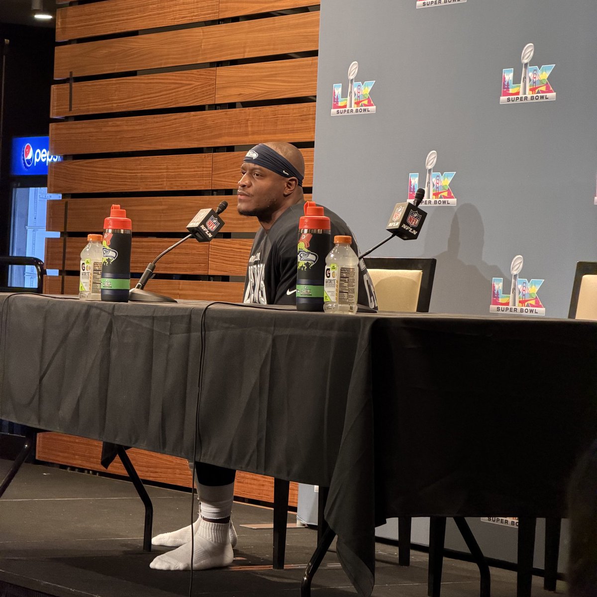 HeavyOnSports's tweet photo. The #SuperBowl MVP Ken Walker played so good it’s a shoes off podium night. #Seahawks #GoHawks https://t.co/pNW3L3gw31
