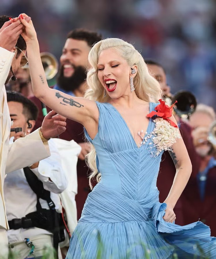5 year old lady gaga in her living room holding a doll of a 39 year old lady gaga performing at the super bowl halftime show 🥹