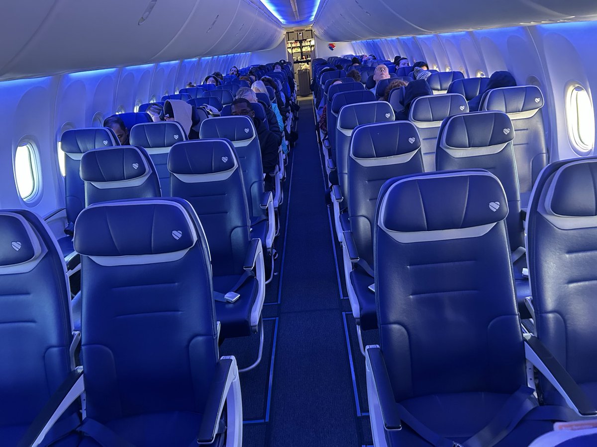 Vict0r66's tweet photo. Southwest Airlines now sucks just like United.  
I am sitting in a full row on a half empty plane but they won’t let me move to an empty row, because the empty seats are more expensive.  Ridiculous https://t.co/jqfbZxlpqz