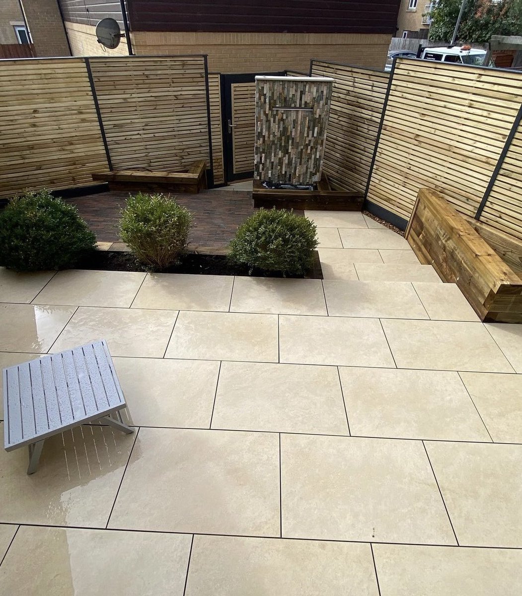 With its clean lines and uniform finish, porcelain paving is a perfect choice for small outdoor spaces, helping create a sleek, low-maintenance surface that makes even compact areas feel open and contemporary.

Image c/o Ground Breaker Construction