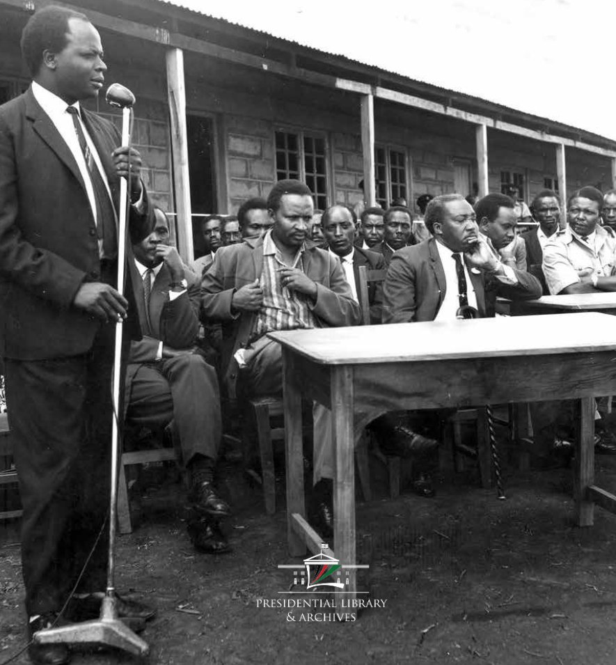 OPLMKe's tweet photo. A young Mwai Kibaki, then Assistant Minister for Economic Planning and Development, speaks in Othaya at the opening of Kiambiriria Bar and Restaurant. Opened by Commerce Minister Eliud Ngala Mwendwa and attended by MP Henry Wariithi, the gathering carries quiet symbolism: Kiambiriria—meaning “a beginning” in Kikuyu—mirroring a formative period in Kenya’s post-independence enterprise and community life.