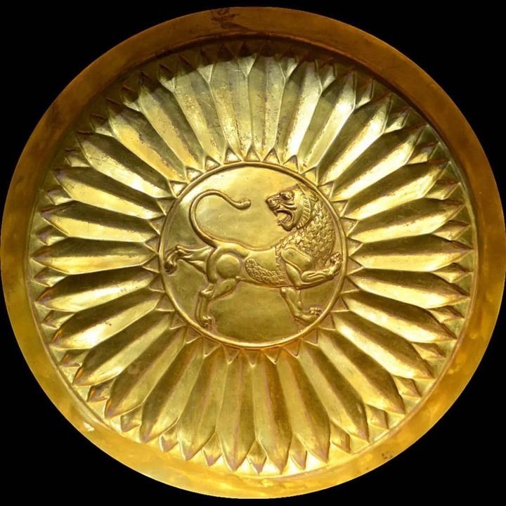 Ancient Aechemenid Iranian gold plate depicting the lion and sun symbol

~500 BC