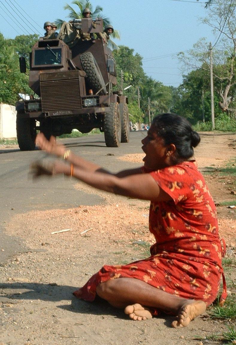 A Tamil mother cries as the Sinhalese army has forcefully taken away her son. (2007)