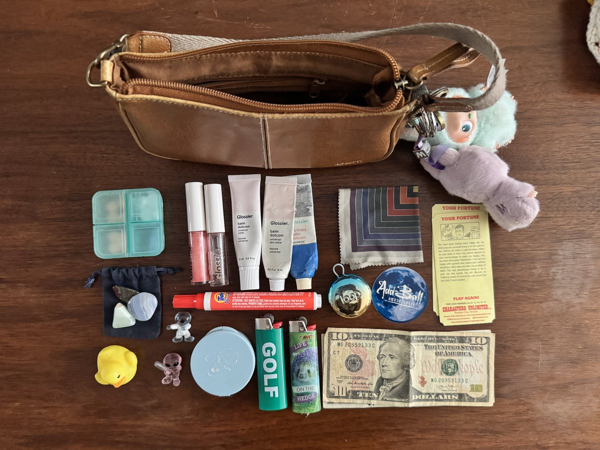 What’s in my bag:
- meds
- 5 glossier lip products
- Frank Stella lens cloth
- 2 fortunes
- The Stone
- tide pen
- earplugs
- aab sticker
- rubber duck
- plastic aliens
- secret compartment
- 2 lighters (I don’t smoke)
- $11